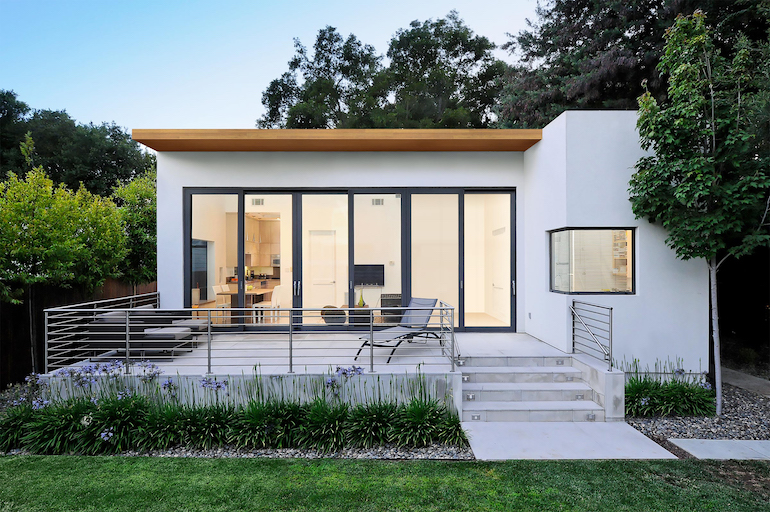 A white ADU Houses in Los Angeles with a big glass windows